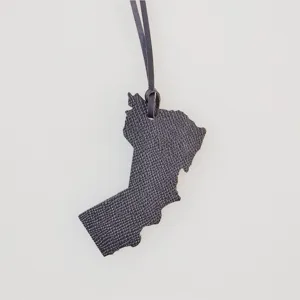 Black leather map pendant bag charm, stylish travel souvenir accessory, minimal keychain decor.