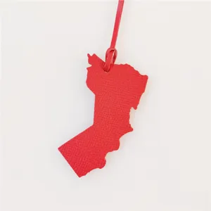 Red leather map shape bag charm, stylish purse accessory, premium leather handbag pendant.