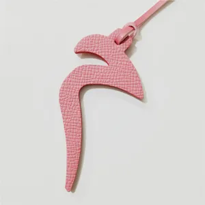 Pink leather Arabic letter bag charm and cute car hanging pendant fashion accessory.