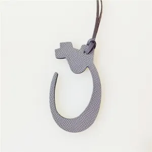Arabic letter leather bag charm detail view, stylish accessory for daily use bags.