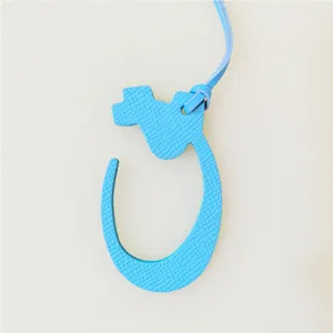 Blue leather Arabic letter bag charm detail, stylish luxury style accessory for bags