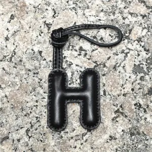 Black leather alphabet H bag charm, premium sheepskin initial keychain for purses and car decor.