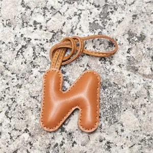 Light brown leather letter H bag charm, soft puffy initial pendant for women handbags and car keys.