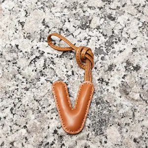 Light brown leather letter V bag charm, sheepskin initial pendant for women and car accessories.