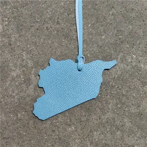 Light blue leather map pendant stylish bag charm and car hanging decoration ornament.