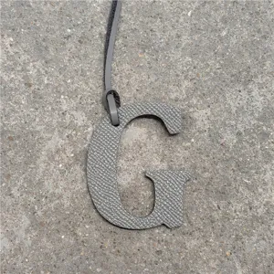 Stylish uppercase letter G leather bag charm pendant, elegant purse hanging ornament accessories.