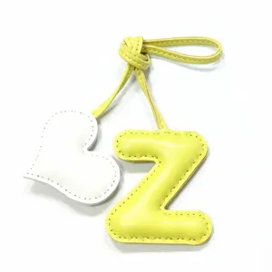 Handcrafted leather letter Z and heart bag charm, stylish yellow and white purse pendant keychain.