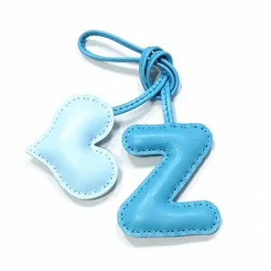 Light blue leather letter Z and heart bag charm detail close up handmade pendant accessory