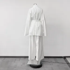 Detail shot of back view of loose belted cardigan and long pants loungewear set in white.
