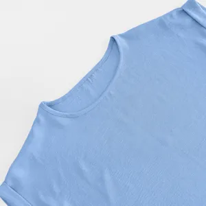 Close-up detail of light blue round neck short sleeve shirt top, soft fabric texture.