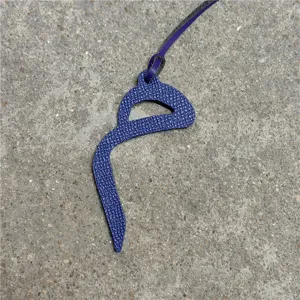 Blue leather Arabic letter bag charm, elegant purse pendant and stylish car hanging ornament.