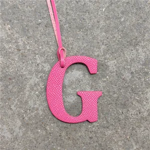 Pink leather letter G bag charm accessory, stylish monogram keychain for women's handbags.