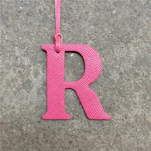 Pink leather letter R bag charm, stylish monogram initial pendant for handbags and purses.