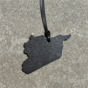 Leather map pendant bag charm car hanging ornament black texture detail view stylish accessory