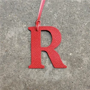 Red leather letter R bag charm, stylish monogram pendant accessory for women handbags and purses.