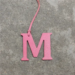 Pink leather letter M bag charm, personalized alphabet keychain and cute car interior accessory.