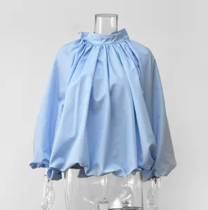 Light blue french style high neck bubble sleeve blouse detail shot, elegant solid color women top