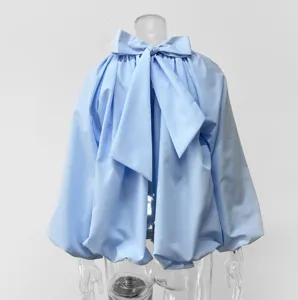 French solid color blouse featuring a stylish back bow, puff sleeves, and chic backless design.
