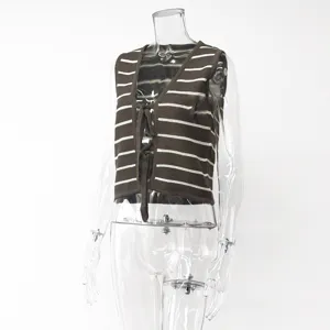 Close-up detail of the stylish brown and white striped knit vest with tie front design.