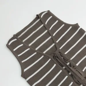 Close-up detail view of the brown and white striped knit vest, showing fine texture.
