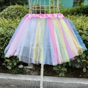 Colorful rainbow tutu skirt for kids, fluffy mesh layers with elastic pink waist, party wear.