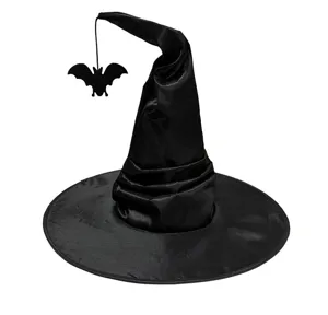 Detailed view of a black witch hat featuring a hanging bat ornament for Halloween parties.