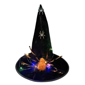 Halloween witch hat detail shot with glowing spider and LED lights for party decor.
