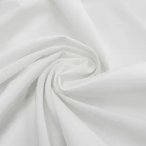 Plain white fabric detail showing soft texture and natural spiral folds for clothing.