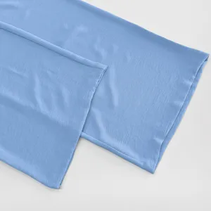 Light blue casual shirt pants fabric material close up detailed view showcase item.