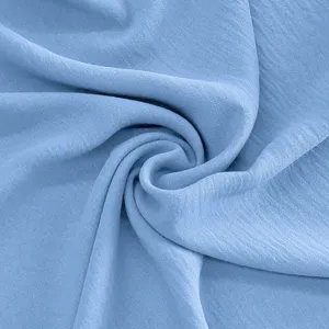 Blue fabric textile material closeup detail showing soft spiral texture and clean look