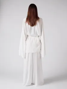Detail shot of the loose solid color belted long sleeve cardigan and pants loungewear set.