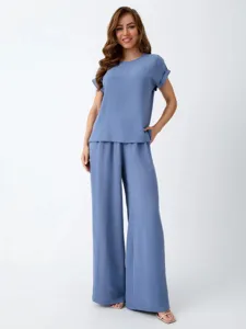 Casual blue two-piece set detail view, showing relaxed fit and soft fabric texture.