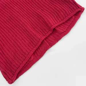 Close-up detail of red thick-needle ribbed knit fabric, showing fine texture and quality.