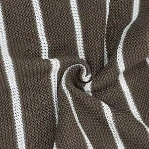 Close-up detail of the brown and white striped knitted fabric, showing soft texture and pattern.