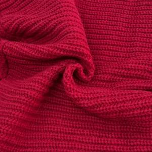 Close-up view showing soft red ribbed knit fabric texture and high quality fabric detail.
