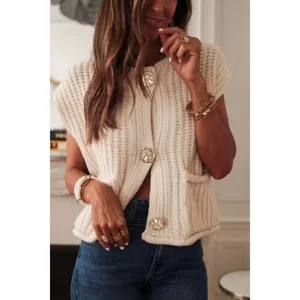 Beige chunky knit sleeveless cardigan vest detail, featuring chic metallic statement buttons.