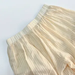Close-up detail of women's summer lightweight striped balloon pants elastic waistband