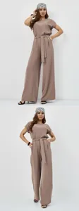 Elegant two-piece set featuring a loose short-sleeve top and wide-leg trousers with a stylish belt.