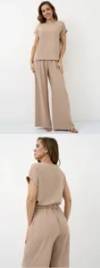 Detail view of casual two-piece set featuring short sleeve blouse and wide-leg pants.