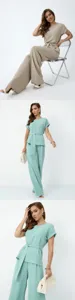 Women two piece casual outfit set detail view, elegant loose top and wide leg pants.