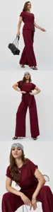 Elegant burgundy two-piece set featuring short sleeve blouse and wide leg pants.