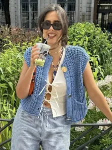 Chunky knit sleeveless vest cardigan for women, blue button-down knitwear top with pockets.