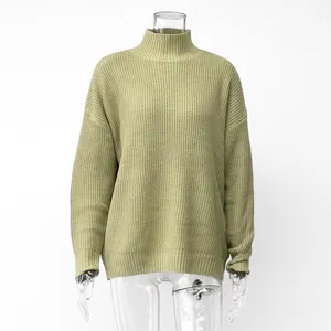 Detailed view of the high-neck ribbed knit sweater, featuring cozy and relaxed fit style.