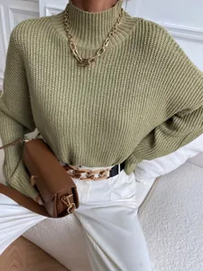 Close-up detail of the olive green ribbed high neck knitted sweater, cozy and stylish fit.