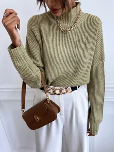 Close-up detail of women's olive green high neck loose knit sweater, stylish fall outfit.