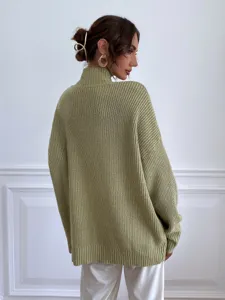 Oversized high-neck knit sweater detail view, cozy ribbed texture in casual green style.