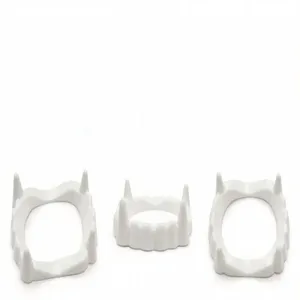 White plastic vampire fangs detail showing the pointed teeth design for Halloween props.