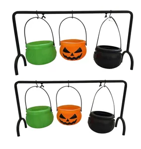 Halloween witch cauldron set with metal stand and three mini candy buckets for party decor.