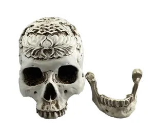 Resin human skull model with intricate carvings, perfect for Halloween and aquarium decor.