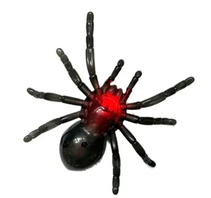Halloween glowing toy spider plastic scary prank prop with red LED lights for party decor.